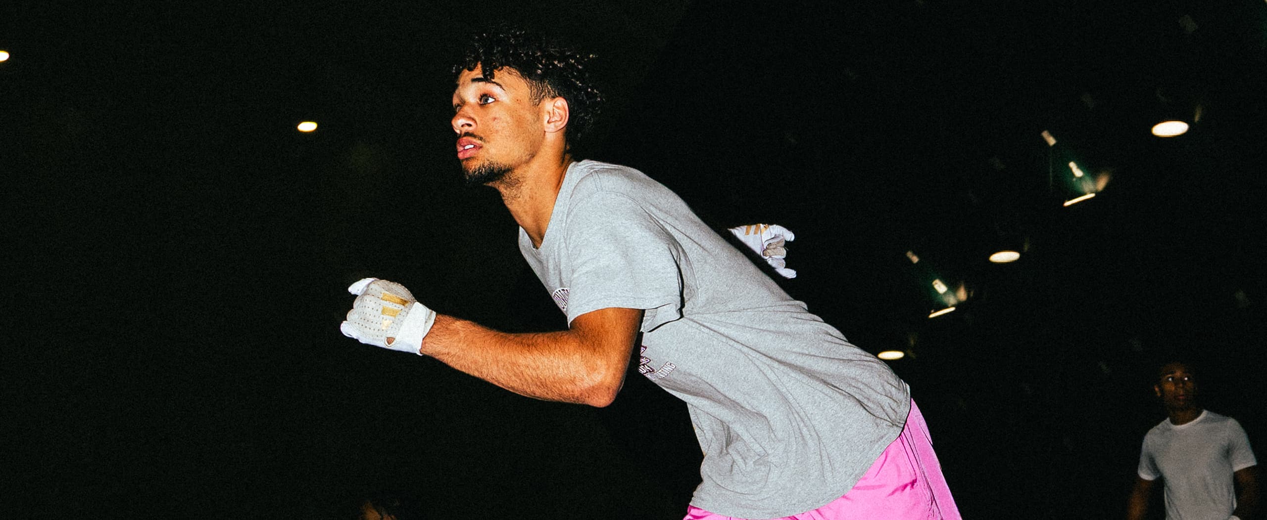 Wide Receiver mid-stride running a route at QB Era training academy