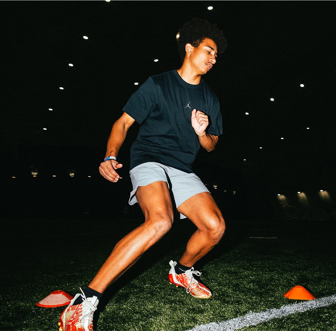 Wide Receiver cutting into a break when approaching speed cones in a drill